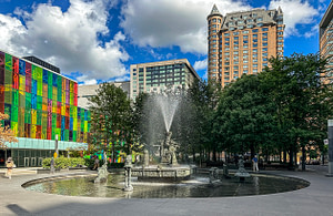 The-Joust-by-Jean-Paul_Riopelle Tom Damoth © 2025 As I explored the city, nearly every street corner revealed a pleasant surprise. After visiting downtown, I took an unfamiliar route and came to Jean Paul Riopelle Place. The brightly colored building provided a perfect backdrop.