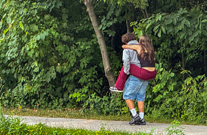 The bumblebees weren’t the only ones enjoying the gardens. This couple swayed and giggled down the sidewalk until suddenly, she pounced on his back. 
We ended up at the same intersection, and I showed them their picture. Technology is amazing. With a click and a bump of phones, they parted with a memory of their first date.
